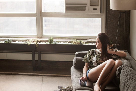 Young woman relaxing with tablet pc on sofa 