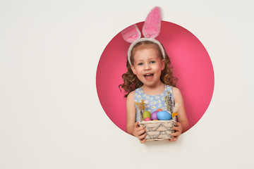 Girl with painted eggs