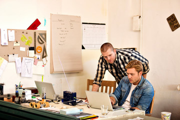Mid adult men working in carpentry workshop 