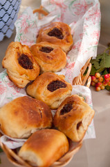 Buns with jam on table