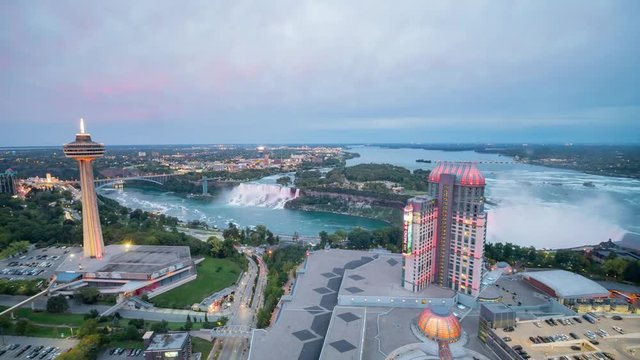 Aerial afternoon to night timelapse of the Skylon Tower and the beautiful Niagara Falls