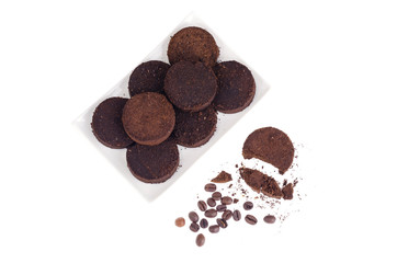 Pressed waste coffee beans on white background