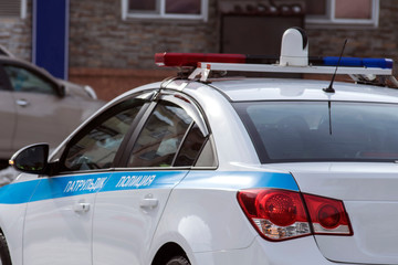white police car with an inscription patrol police on board