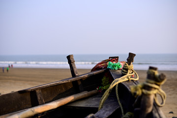 Close-up of empty fishing boat in sea beach.
