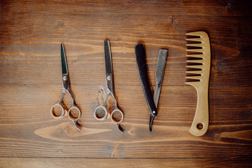 Barber equipment and tools on wood table background