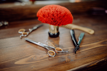 Tools for cutting beard barbershop top view on wooden background