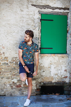 Mid adult man leaning against wall 