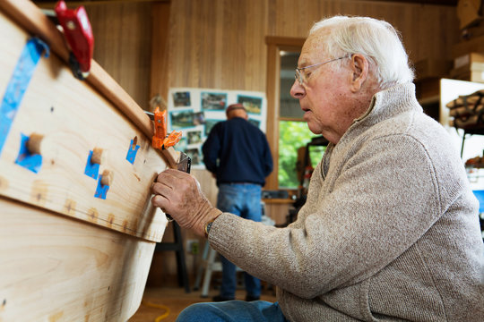 Side-view of shipbuilder working 