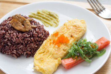 Rice with omelette on plate