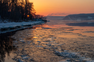 Melting ice on the river. Spring. Sunset on the Volga River