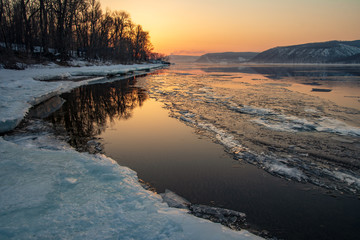 Melting ice on the river. Spring. Sunset on the Volga River