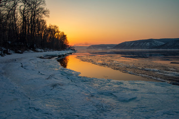 Melting ice on the river. Spring. Sunset on the Volga River