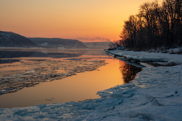 Melting ice on the river. Spring. Sunset on the Volga River