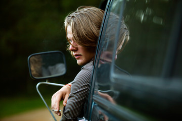 View of young man smoking cigarette 