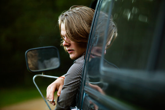 View of young man smoking cigarette 