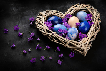 Easter eggs in heart shaped nest