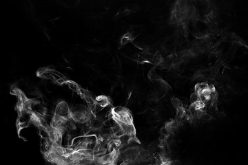 Smoke the white incense on a black background. darkness concept