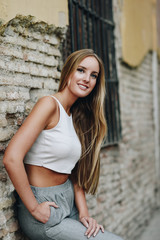 Fototapeta premium Blond girl wearing casual clothes in the street. 