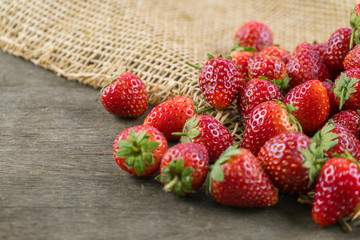 Strawberries on wooden table.