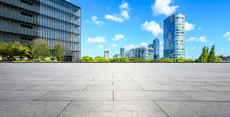 Fototapeta premium Empty square ground and modern commercial buildings in Shanghai