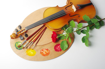 Violin, art palette and brushes, red rose.