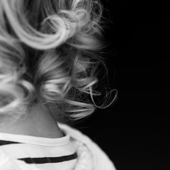 Black and White square photo of little girl's hair curls