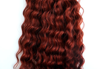 Isolated close up of wavy and curly hair extension