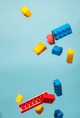 Floating Plastic geometric cubes in the air. Construction toys on geometric shapes falling down in motion.