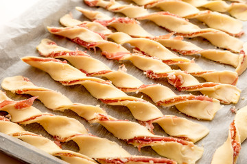 Breadsticks with bacon to be cooked