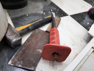 Repair building with tools and hammer, chisel, cleaver and tape measure on the floor