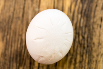 hen's egg with marks on the shell