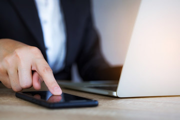 Closeup hand of business woman using smart mobile phone at office