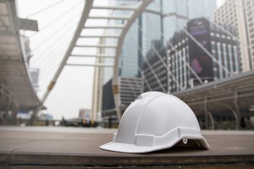 Hard safety helmet hat for safety project of workman as engineer or worker, on concrete floor