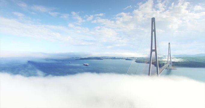 Static aerial view of Russian bridge, longest cable-stayed bridge in the world. It connects Russky Island and Vladivostok across the Eastern Bosphorus strait. Light morning fog and clouds above it