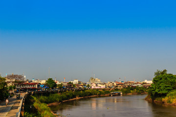 Fototapeta na wymiar Landscape of Muang district, Phichit province, Thailand in summer with colorful houses and a blue sky on Nan river bank. Phichit is a province of Thailand and far 330 km from Bangkok.
