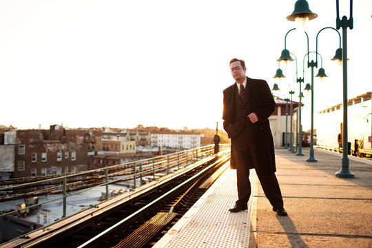Businessman waiting for train 