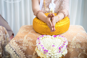 Fototapeta na wymiar Traditional Thai wedding ceremony in local luxury vintage costume and wedding equipment.