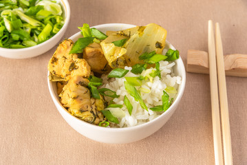 Bowl of rice and chicken with chinese cabbage, chopsticks - Japanese dish.