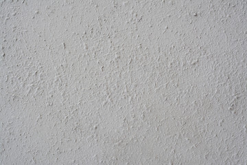 Texture of old concrete wall covered with white plaster