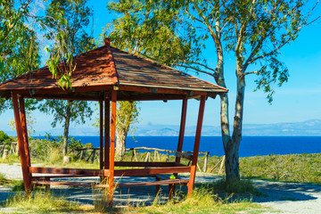 Benches under shelter in Greece near sea