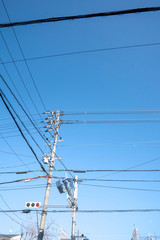electric pole and electricity post with trafic light sign on the open sky, Japan