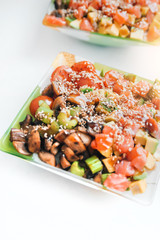Poke bowl of rice with avocado, mushrooms and salmon