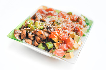 Poke bowl of rice with avocado, mushrooms and salmon