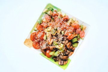 Poke bowl of rice with avocado, mushrooms and salmon