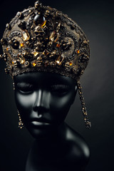 Mannequin head in creative metallic kokoshnick with skulls