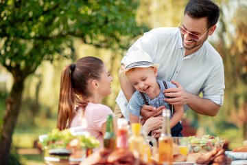 Obraz premium Happy family having a barbecue