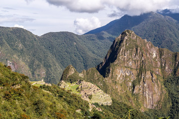 Fototapeta na wymiar Machu Picchu and Huayna Picchu mountain in Peru, seen from the door of the sun