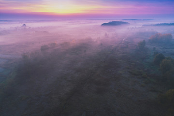 Early foggy morning. Aerial view of countryside and country road