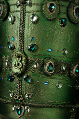 Mannequin in green Egiptian head wear with precious stones 