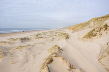 Dutch dunes by the sea from above in mystical late afternoon sun